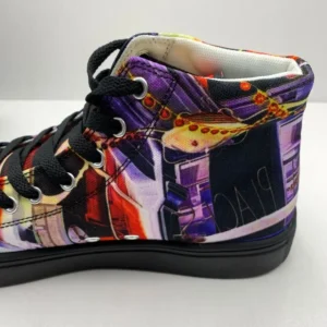 Paul Corps custom printed high-top canvas shoe featuring a vibrant, abstract cityscape design in bold colors with black laces and sole. Showing inside back of shoe.