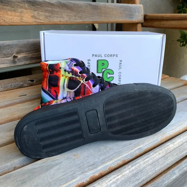 Paul Corps custom printed high-top canvas shoe featuring a vibrant, abstract cityscape design in bold colors with black laces and sole. With shoes in front of Branded Paul Corps Show Box with one shoe showing sole.