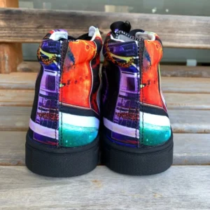 Paul Corps custom printed high-top canvas shoe featuring a vibrant, abstract cityscape design in bold colors with black laces and sole. Showing the heels of the shoes