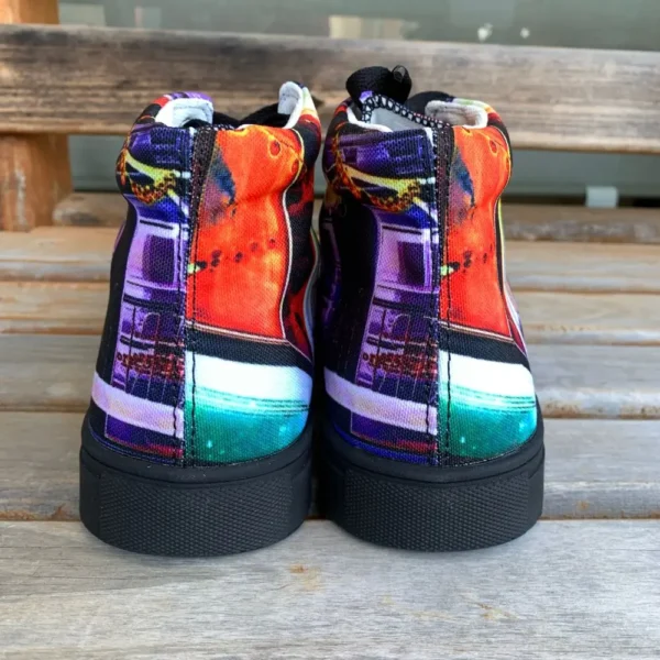 Paul Corps custom printed high-top canvas shoe featuring a vibrant, abstract cityscape design in bold colors with black laces and sole. Showing the heels of the shoes