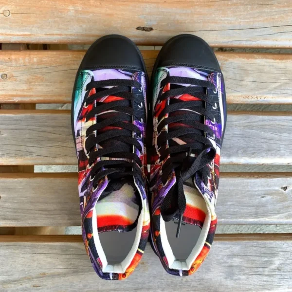 Paul Corps custom printed high-top canvas shoe featuring a vibrant, abstract cityscape design in bold colors with black laces and sole. With top view of shoes