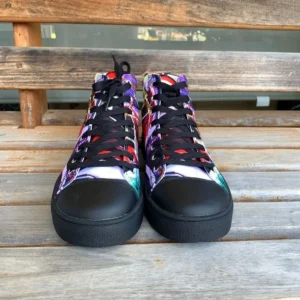 Paul Corps custom printed high-top canvas shoe featuring a vibrant, abstract cityscape design in bold colors with black laces and sole. With shoes facing frontwards.