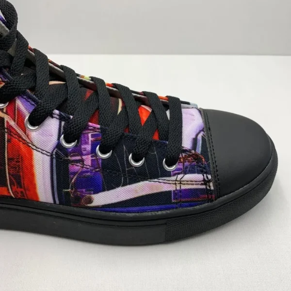 Paul Corps custom printed high-top canvas shoe featuring a vibrant, abstract cityscape design in bold colors with black laces and sole. Showing Toe and side of shoe.