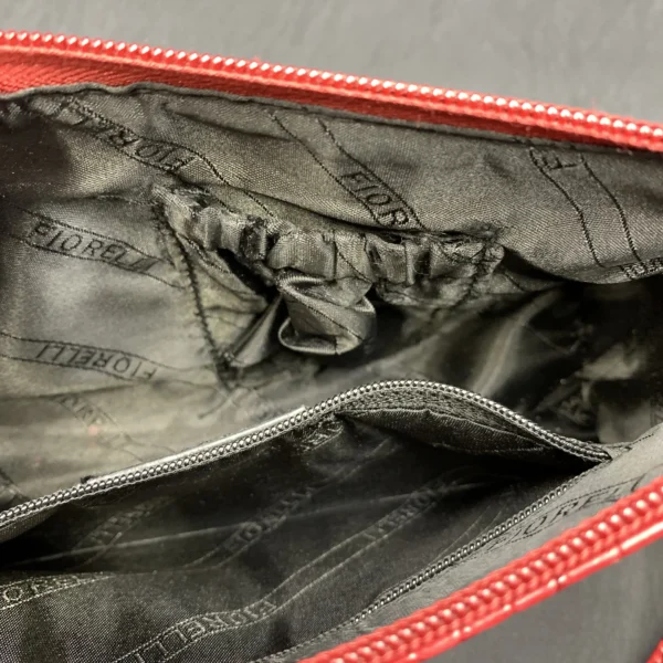 Vintage Fiorelli red shoulder bag with faux croc/snake textures, gold hardware, zip closure, and branded lining.