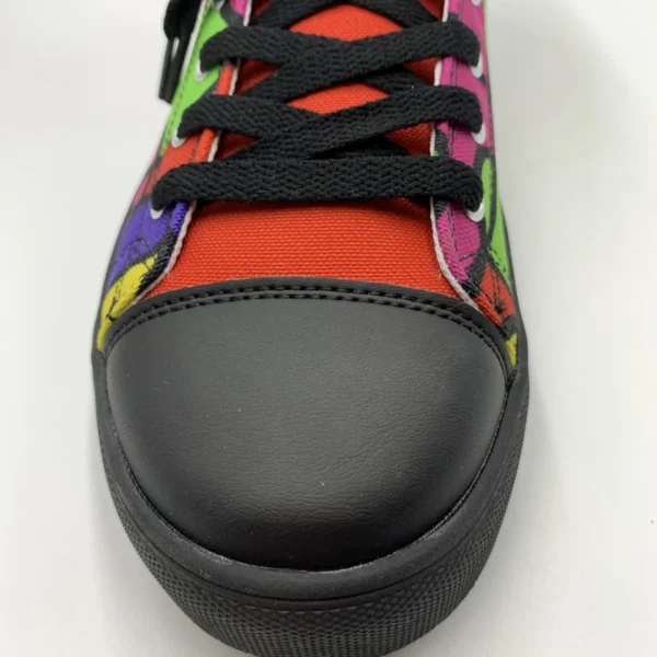 Close-up front view of a Lava Lamp Memories high-top canvas shoe by Paul Corps, showing the black toe cap, black laces, and vibrant red, green, purple, and yellow abstract pattern.