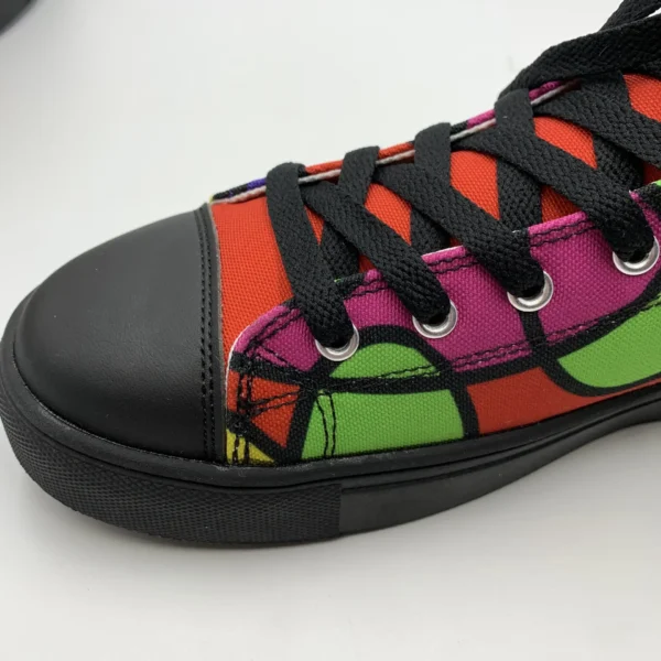 Close-up side view of the heel and ankle area of a Lava Lamp Memories high-top canvas shoe by Paul Corps, featuring a vivid abstract pattern in green, yellow, pink, and red with black outlines and black sole.