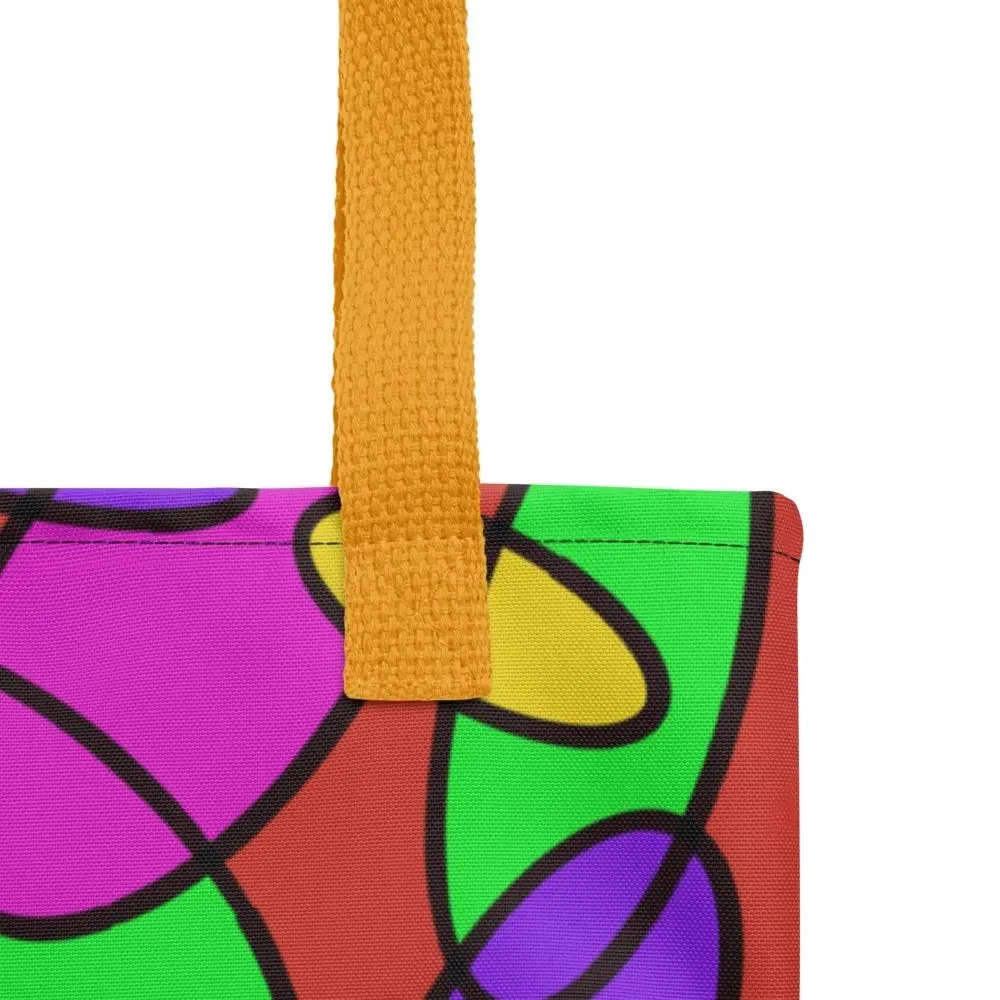Close-up of the top corner of a Lava Lamp Memories all-over print tote bag, showing the yellow handle and detailed stitching with the colourful abstract pattern in green, purple, yellow, and pink