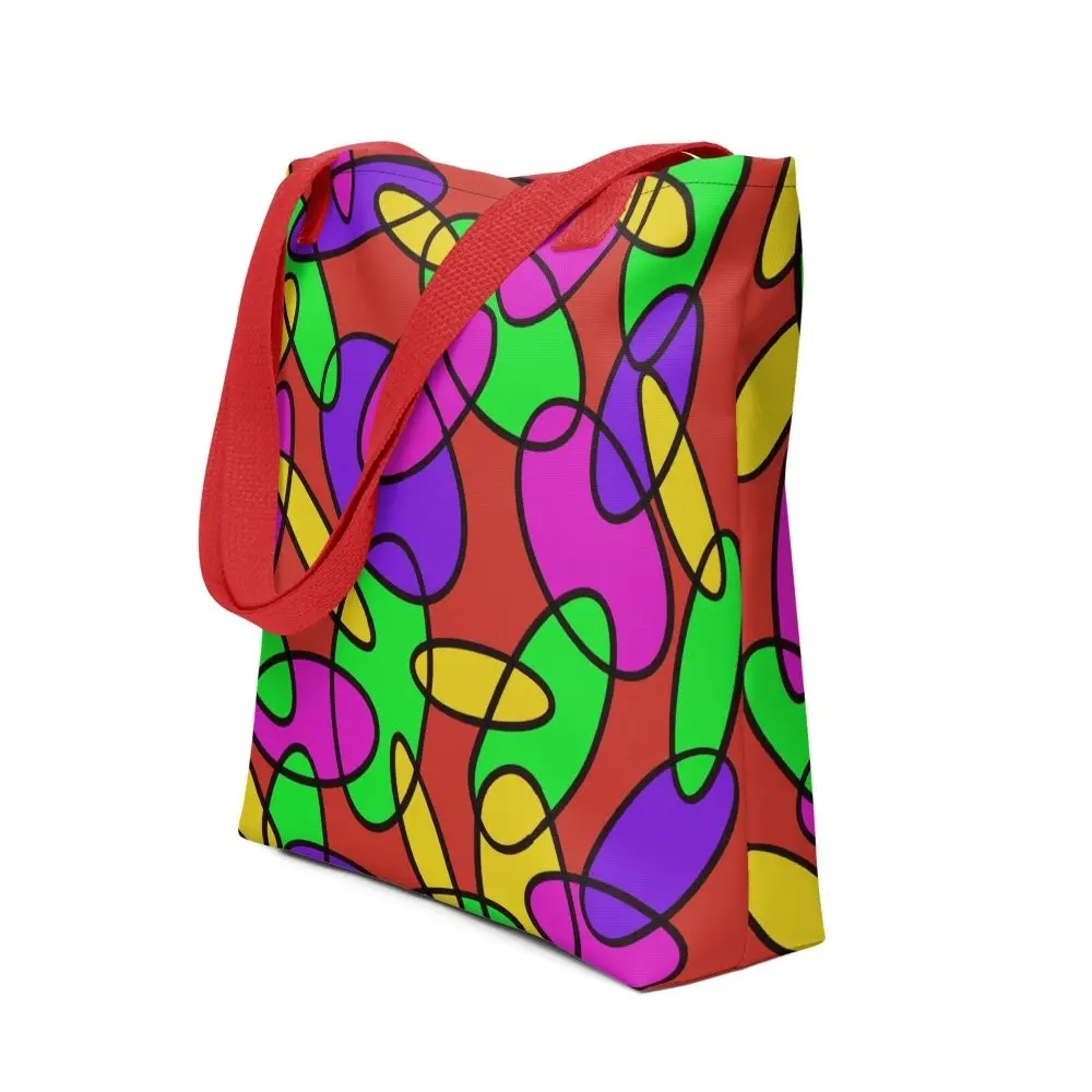 A Lava Lamp Memories all-over print tote bag with a vibrant abstract pattern in green, purple, yellow, and pink on a red background, featuring red handles