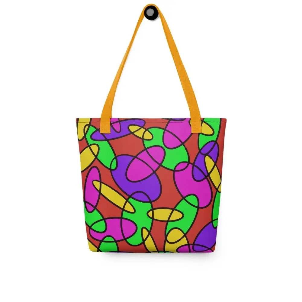 Front view of a Lava Lamp Memories all-over print tote bag with yellow handles, featuring a bold abstract pattern in green, purple, yellow, and pink on a red background