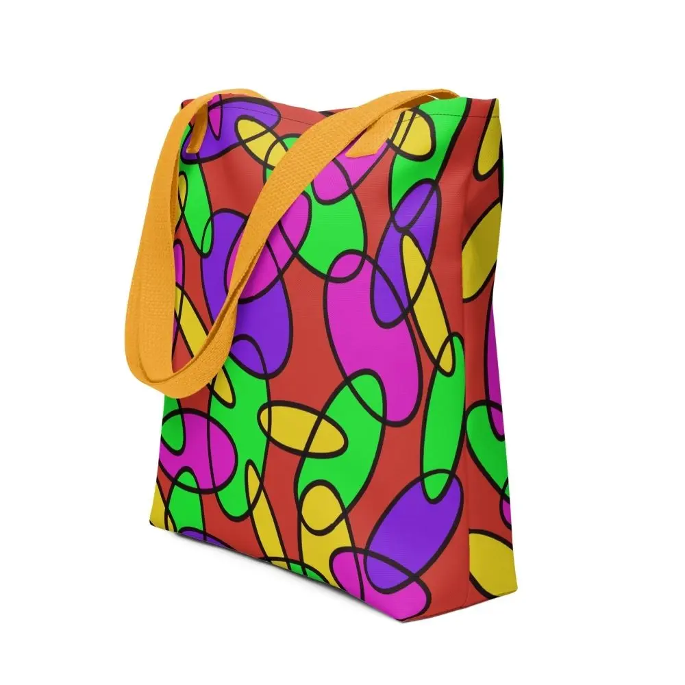 A Lava Lamp Memories all-over print tote bag with a vibrant abstract pattern in green, purple, yellow, and pink on a red background, featuring yellow handles