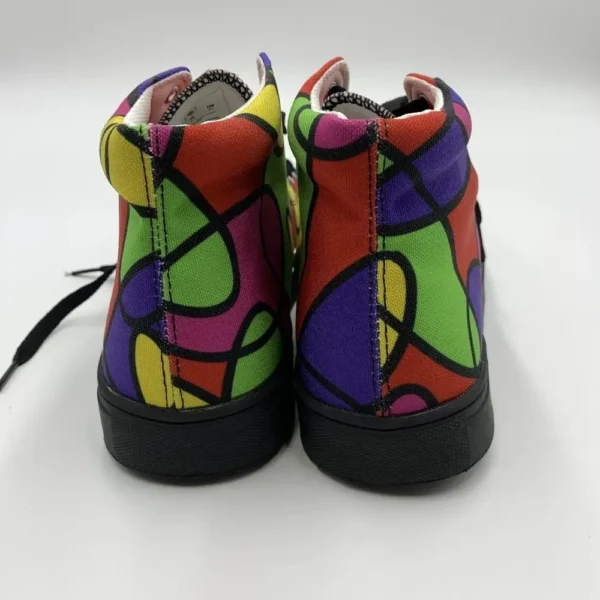 Rear view of a pair of Lava Lamp Memories high-top canvas shoes by Paul Corps, showing the colorful abstract pattern in green, red, yellow, and purple with black soles.