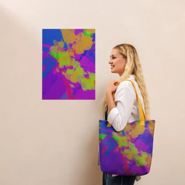 A person wearing a Kaleidoscope Dream all-over print tote bag with yellow handles over their shoulder, standing in front of a matching abstract art print on a beige wall