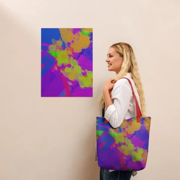 A person wearing a Kaleidoscope Dream all-over print tote bag with red handles over their shoulder, standing in front of a matching abstract art print on a beige wall