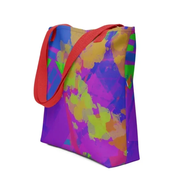 A Kaleidoscope Dream all-over print tote bag with a vibrant abstract pattern in green, purple, yellow, blue and pink, featuring red handles