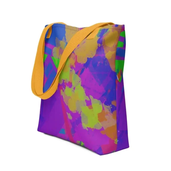 A Kaleidoscope Dream all-over print tote bag with a vibrant abstract pattern in green, purple, yellow, blue and pink, featuring yellow handles