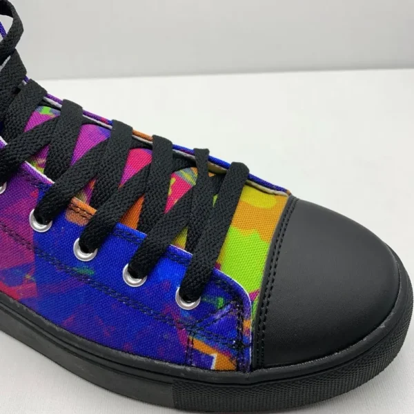 A pair of Paul Corps Kaleidoscope Dream High Top Canvas Shoes featuring a vibrant, abstract pattern in purple, blue, green, and orange, with black laces and black soles, displaying side view of front of shoe