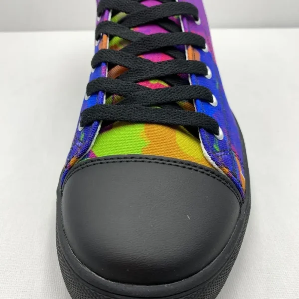 A pair of Paul Corps Kaleidoscope Dream High Top Canvas Shoes featuring a vibrant, abstract pattern in purple, blue, green, and orange, with black laces and black soles, displaying front of shoe