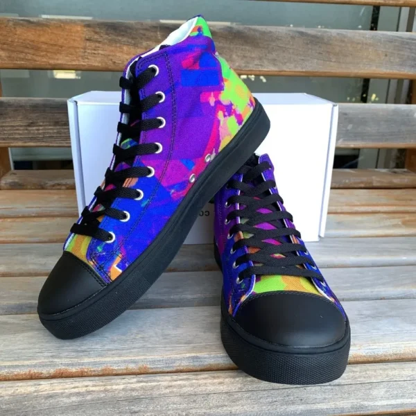 A pair of Paul Corps Kaleidoscope Dream High Top Canvas Shoes featuring a vibrant, abstract pattern in purple, blue, green, and orange, with black laces and black soles, displayed in front of a branded Paul Corps shoe box.