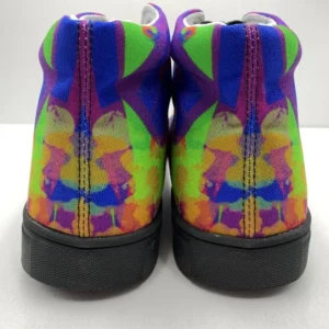 A pair of Paul Corps Kaleidoscope Dream High Top Canvas Shoes featuring a vibrant, abstract pattern in purple, blue, green, and orange, with black laces and black soles, displaying back of shoe