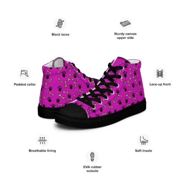 A pair of Paul Corps high-top canvas shoes with a vibrant pink background, decorated with black paw prints and white bone motifs, black laces, and black soles.