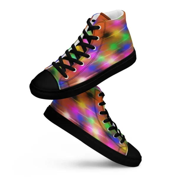A pair of Paul Corps high-top canvas shoes featuring a bold spray paint-inspired design with vibrant streaks of blue, pink, orange, and yellow, black laces, and black soles.