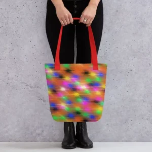 A Paul Corps large tote bag featuring a vibrant spray paint-inspired design with dynamic streaks of blue, pink, orange, and yellow on a black background, finished with sturdy black, red or yellow handles.