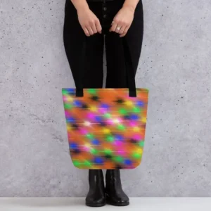 A Paul Corps large tote bag featuring a vibrant spray paint-inspired design with dynamic streaks of blue, pink, orange, and yellow on a black background, finished with sturdy black, red or yellow handles.
