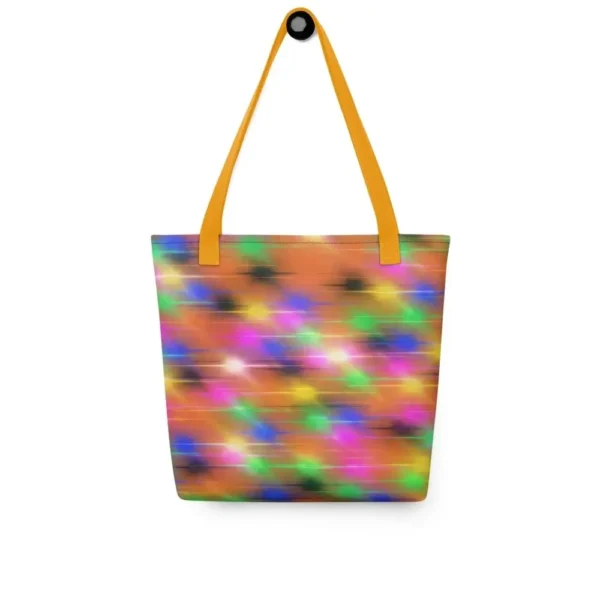 A Paul Corps large tote bag featuring a vibrant spray paint-inspired design with dynamic streaks of blue, pink, orange, and yellow on a black background, finished with sturdy black, red or yellow handles.