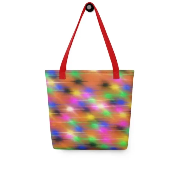 A Paul Corps large tote bag featuring a vibrant spray paint-inspired design with dynamic streaks of blue, pink, orange, and yellow on a black background, finished with sturdy black, red or yellow handles.