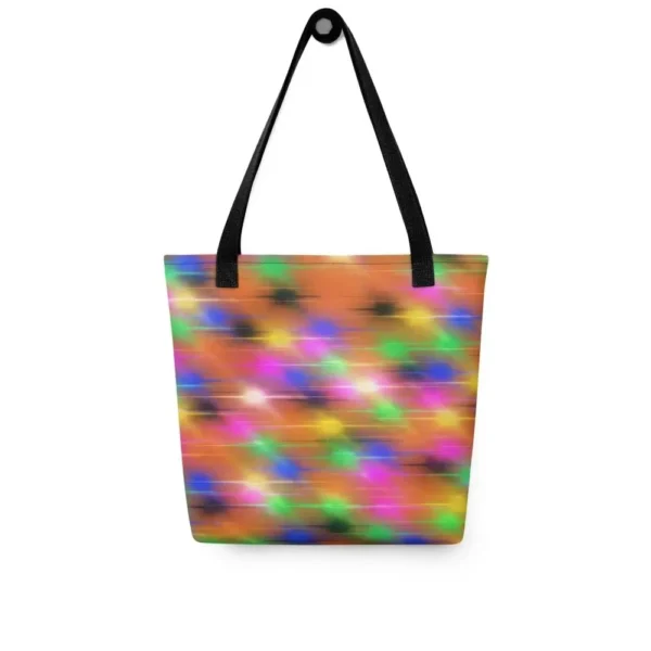 A Paul Corps large tote bag featuring a vibrant spray paint-inspired design with dynamic streaks of blue, pink, orange, and yellow on a black background, finished with sturdy black, red or yellow handles.