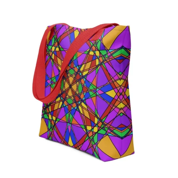 A Stain Glass Effect all-over print tote bag with a vibrant abstract pattern in green, purple, yellow, and pink, featuring red handles