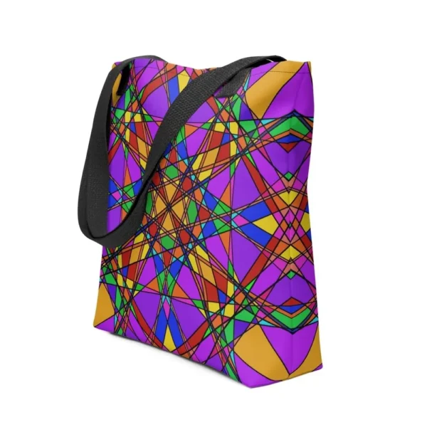 A Stain Glass Effect all-over print tote bag with a vibrant abstract pattern in green, purple, yellow, featuring black handles