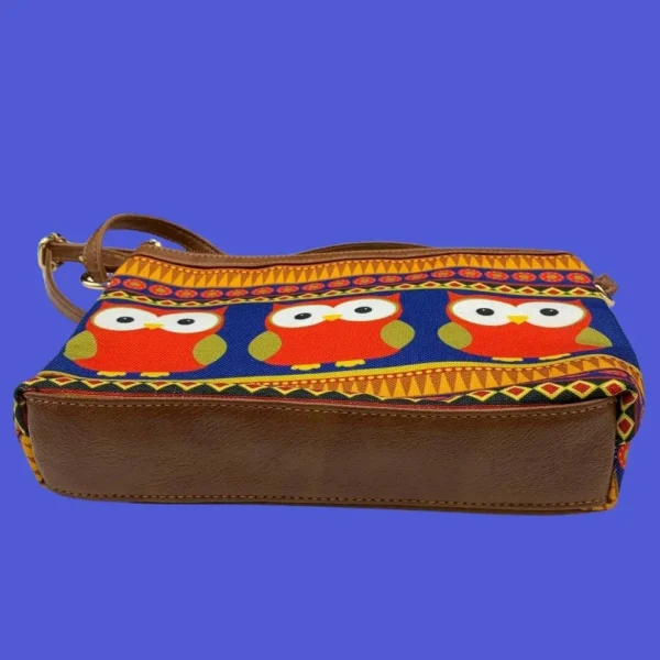 Colourful owl sling bag from All Things Sundar with intricate Indian-inspired design on beige canvas.